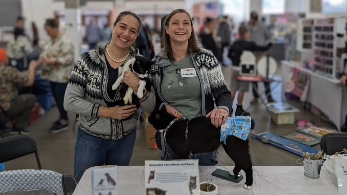 Gray Muzzle Society volunteers at a community adoption event